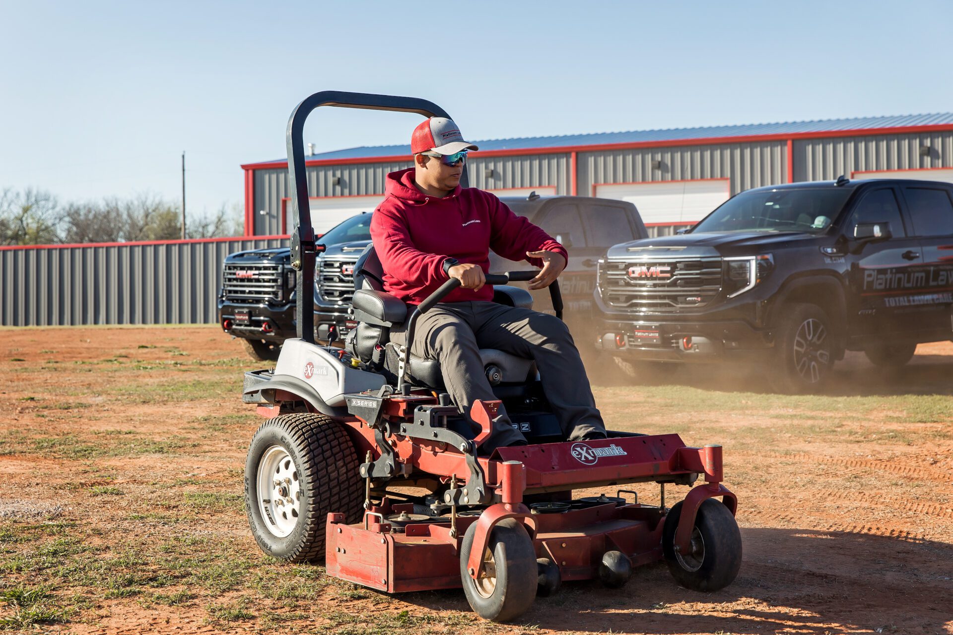 a person driving a lawn mower